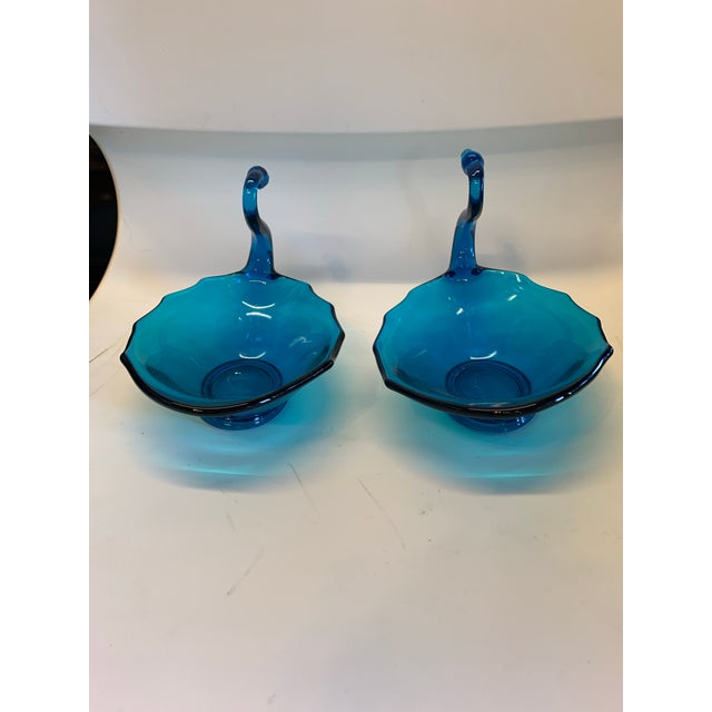 Pair of 2 Blue glass swans . Beautiful decor or many ideas to use in these around the house. To name a few ideas - candy...