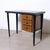 Beautiful and original writing desk with drawers and a glass top, featuring a wooden frame with black lacquered legs. Mid-...