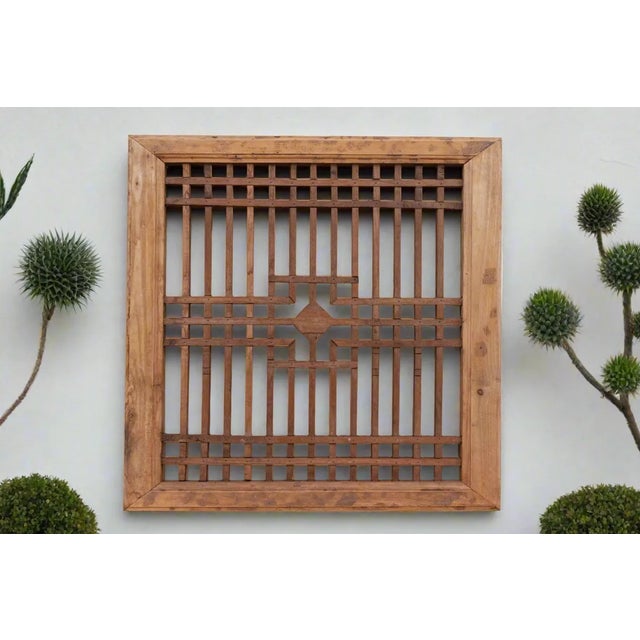 A traditional architectural feature of Chinese buildings, this beautiful antique Chinese lattice window was prominent in...