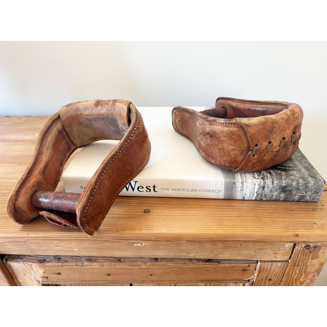 Add texture and character to your southwest or eclectic décor with this pair of vintage leather western horse saddle...