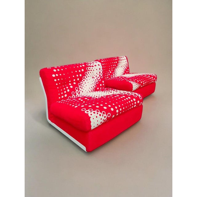 A stunning pair of "amanta" armchairs, original from the 1970s, designed by mario bellini with fabrics by gaetano pesce...