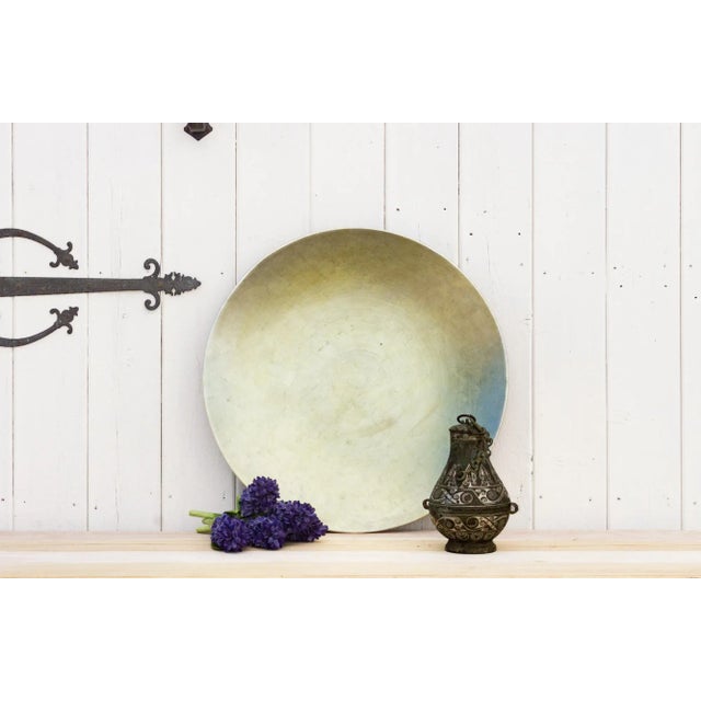 An elegant display piece, this late 20th century extra large bowl that features a beautiful silver leaf lacquered finish....