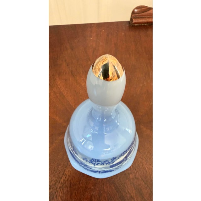 Charming vintage Currier & Ives decorative porcelain bell featuring the classic “Home in the Wilderness” winter scene....