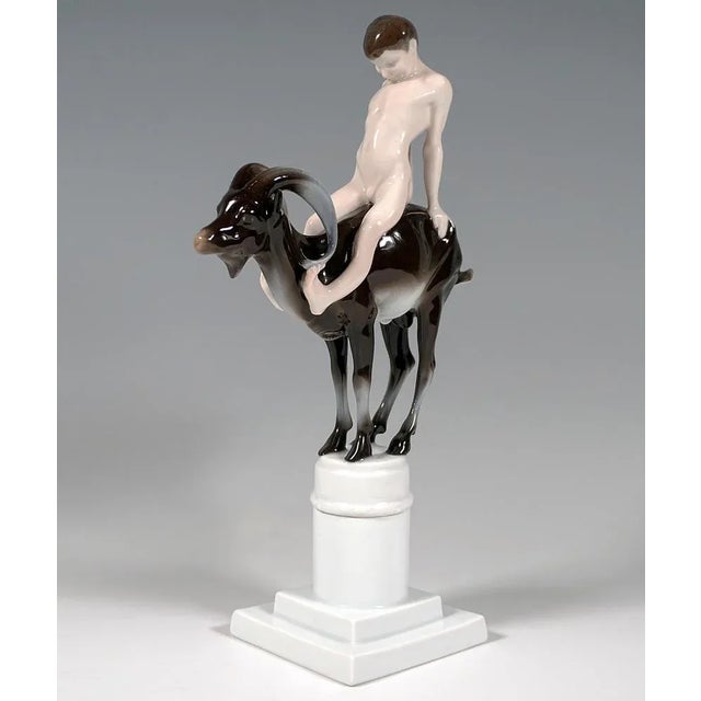 Admirable Art Nouveau Figure Group by Rosenthal. Naked faun-like boy sitting on the back of an ibex, straining his upper...