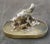 Solid silver sculpture representing a hen and her chicks in front of a frog on a hard stone base set in silver. Hallmark...