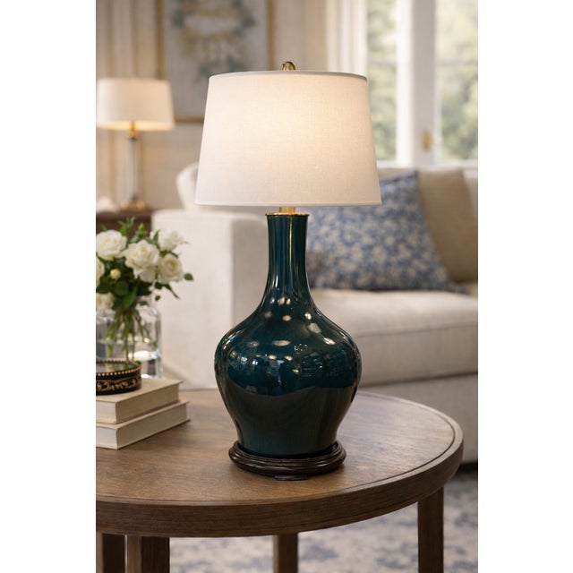 Dark green glazed ceramic table lamp with a glossy finish and organic silhouette. Sold without bulb or shade. European...