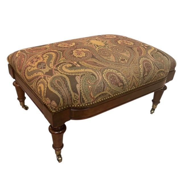 Elegant upholstered ottoman designed by Oscar de la Renta for Century Furniture. Features a solid wood frame with...