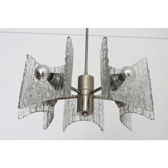This stunning mid-century modern chandelier by Kaiser Leuchten, dating from the 1970s, is a beautiful example of German...