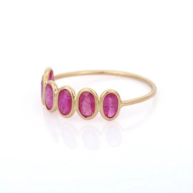 This is part of Chairish’s Fine Jewelry assortment. Ruby half eternity band ring in 18K gold symbolizes the everlasting...
