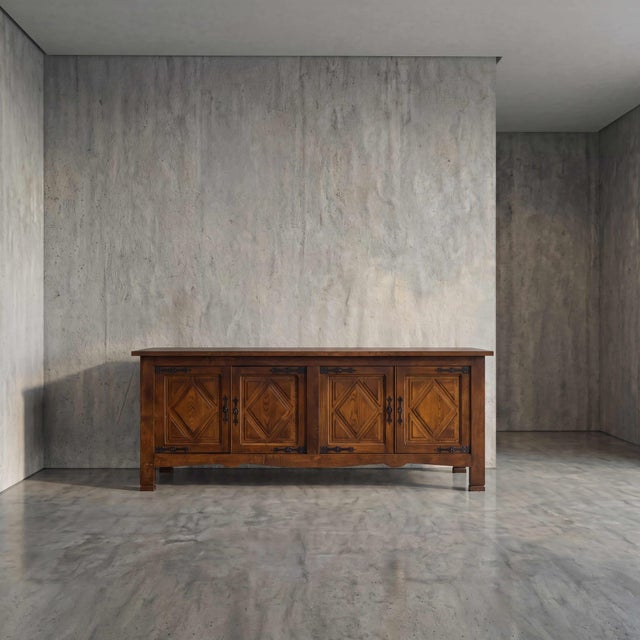 A monument to textural contrast, this four-door enfilade features commanding geometric diamond parquet panels rendered in...