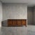 A monument to textural contrast, this four-door enfilade features commanding geometric diamond parquet panels rendered in...