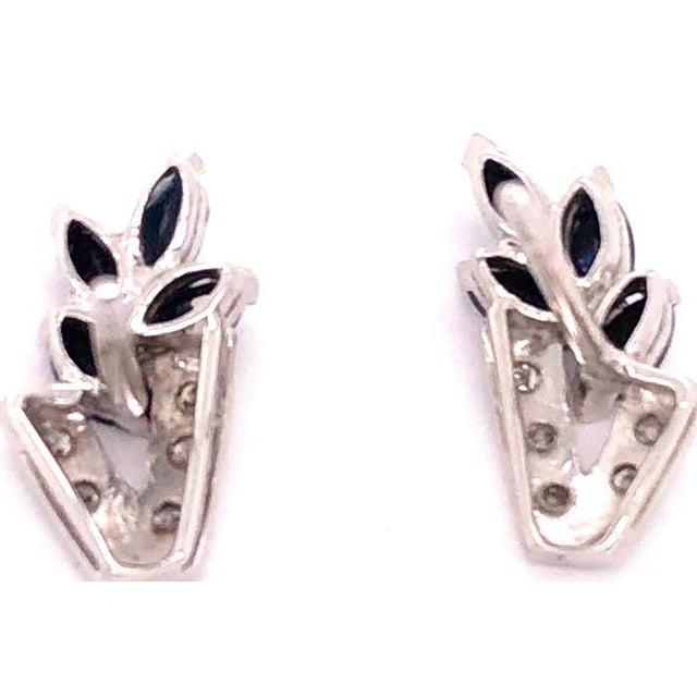 14 Kt White Gold Diamond And Sapphire Cluster Earrings 0.12 Total Diamond Weight. 2.7 grams total weight.
