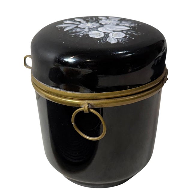 A charming late 19th century French black opaline glass box, beautifully decorated with delicate hand-painted enamel...
