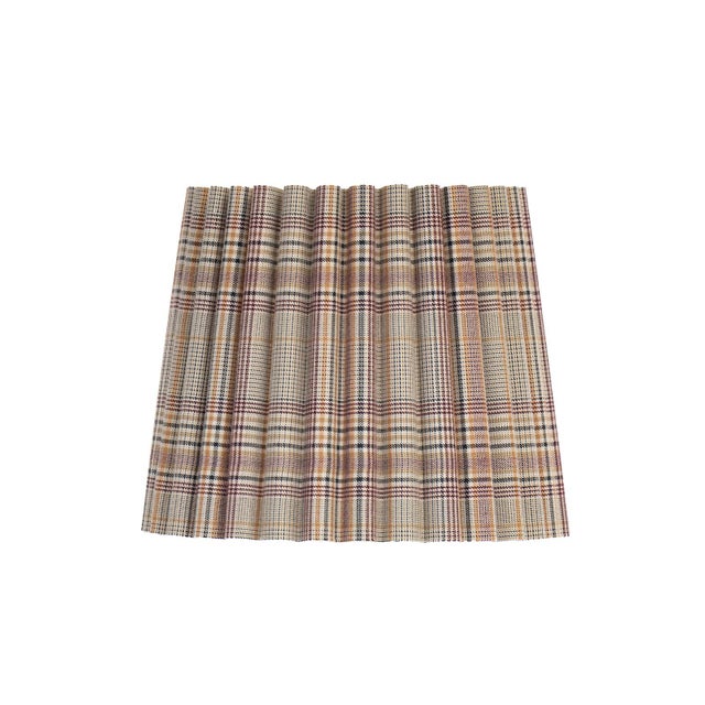 The Heritage Plaid Wave Pleat Alternate Shade pairs a timeless graphic plaid with a structured, hard-backed construction....