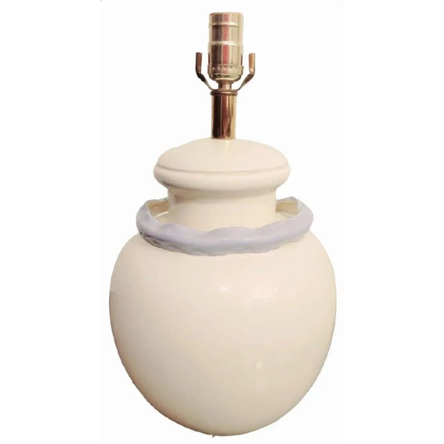 An beautiful pair of vintage round ceramic table lamps with an incredible raised 3d ribbon front. The lamps themselves are...