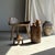 Side table in brown petrified wood. Petrified wood is a fossilized wood (same family as magnolia) dating back 20 million...