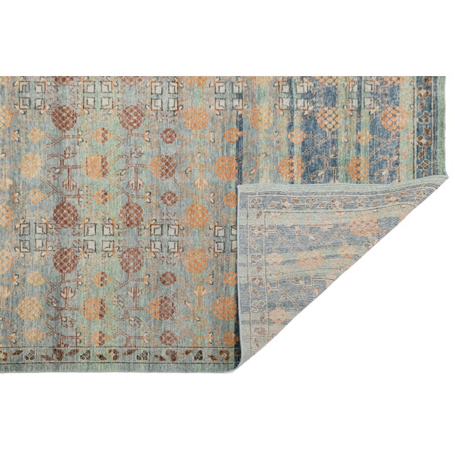 Bring a blend of timeless tradition and contemporary design to your home with this Modern Khotan Style Hand-Knotted Wool...