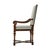 A hand-carved armchair, the rectangular padded back and an upholstered seat on turned tapering legs joined by a wavy "X"...