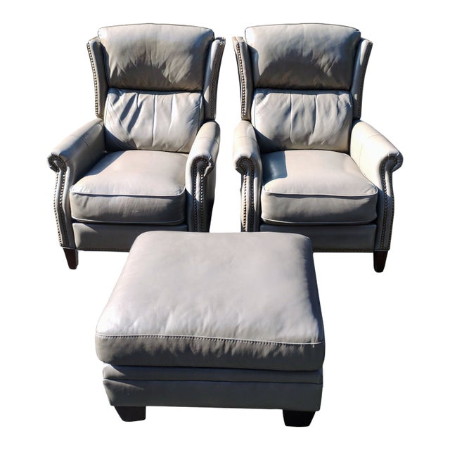 Elevate Your Living Space With This Exquisite Pair of Recliners & Matching Ottoman For Sale