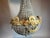 A striking matched pair of French Louis XVI–style chandeliers, dating from the 1960s and crafted in solid bronze with warm...