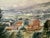 Original watercolor on paper depicting a broad rural landscape with hillside buildings, trees, a winding road and distant...