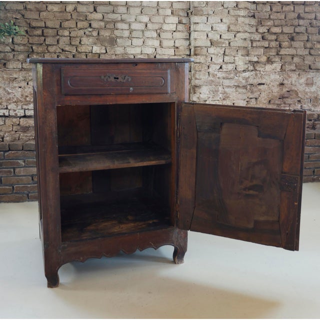 A late 18th century French provincial confiturier (petit buffet) in walnut with oak as secondary wood, retaining its...
