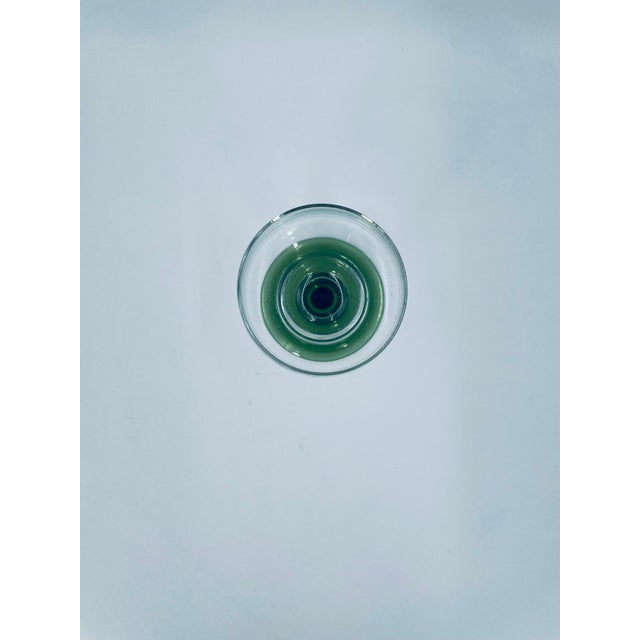 Römer wine glass, crafted from high-quality crystal glass. The glass features a clear bowl, a decorative, ribbed stem, and...