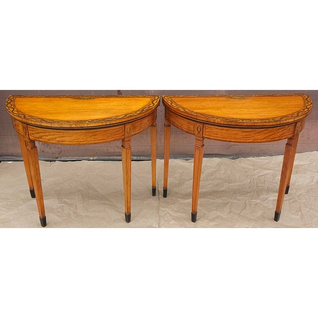 A magnificent pair of George III period crossbanded satinwood and Flover wreath Painted demi-lune card tables from...
