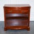 Vintage Serpentine Bow Front Dwarf Open Bookcase. It is a charming and functional piece of furniture, a testament to the...