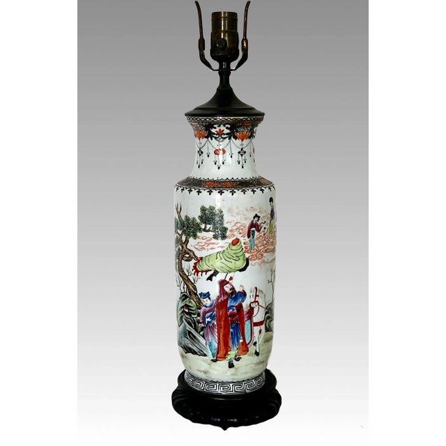 Beautifully hand enamelled Famille Rose, Republic Period converted porcelain table lamp mounted on an old hand carved wood...