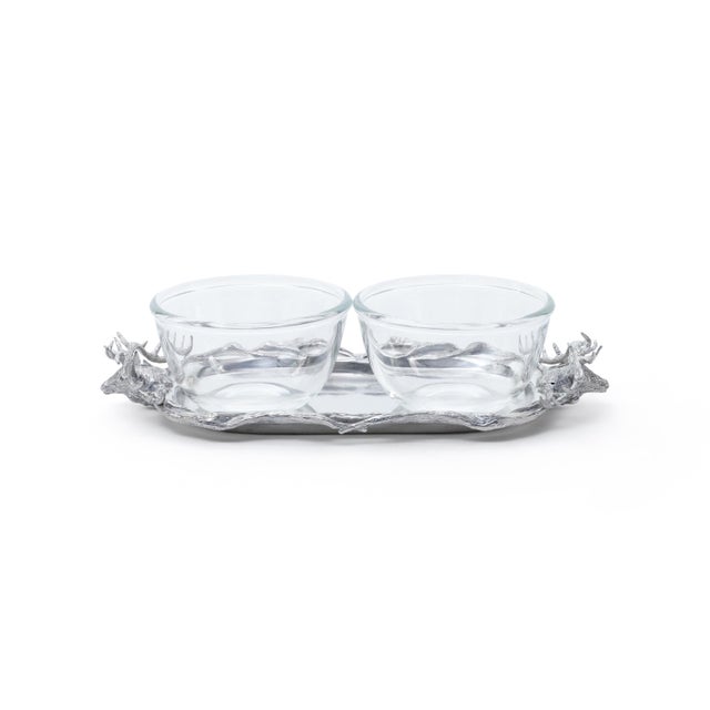 This pewter serving tray brings a striking stag head silhouette to your entertaining spread, complete with inset glass...