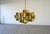 Stunning Sculptural brass chandelier by C. Jere, signed and dated 1975. Features a dramatic layered design of interlocking...
