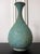 An antique Korean bronze bottle of bulbous pear form with a long neck and flared open mouth from Goryeo Dynasty (918...