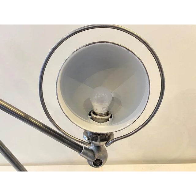 Genuine old Jieldé lamp on base with two 40cm arms Lamp entirely stripped, brushed and coated with a black graphite wax...