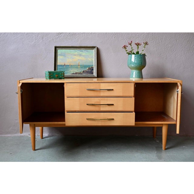 Refined and with soft lines, this retro TV stand is a Scandinavian-inspired piece that's easy to integrate into any decor....