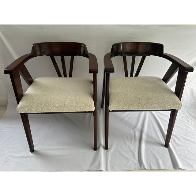 Pair of compass chair in walnut color, reupholstered in white boucle.