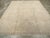 An antique Turkish Oushak room size carpet. The beige field of this essentially tone-on-tone western Turkish carpet has a...
