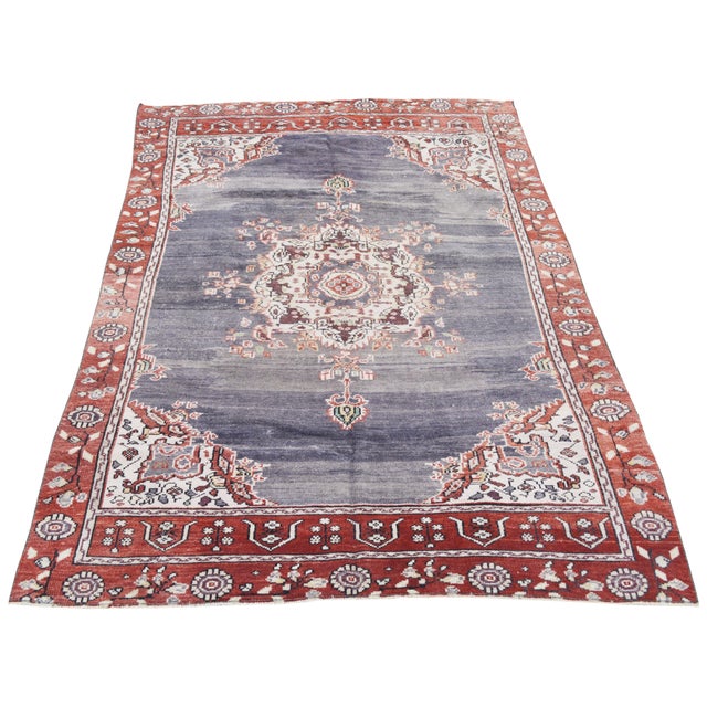 Hand-knotted with care using traditional rug making techniques, this wool rug blends timeless craftsmanship with a modern...