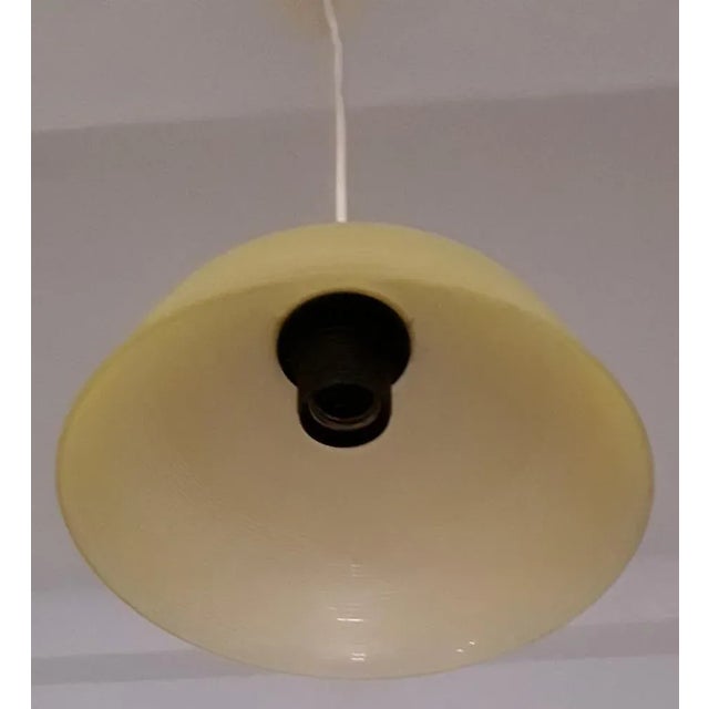 Ceiling Lamp with Cream Plastic Mount & Yellow Patterned Glass Shade from ARO, 1960s, in Good conditions. Designed 1960 to...