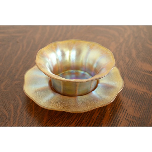 A gorgeous Arts & Crafts or Art Nouveau period Favrile iridescent art glass finger bowl with underplate By Louis Comfort...