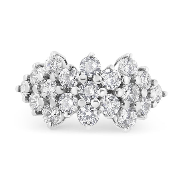 Elevate your style with the captivating allure of this stunning ring, expertly fashioned in 14K white gold. The...
