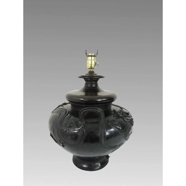 Antique round form bronze table lamp - late Meiji period. The censor shaped body of this eye catching Japanese lamp is...