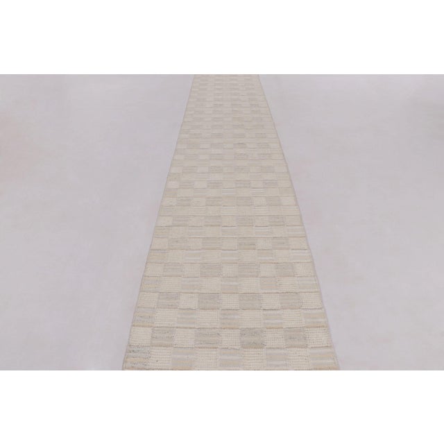 Handwoven in wool, this 3x27 Scandinavian runner flatweave from Rug & Kilim features geometric patterns and high-low pile...