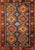 This vibrant vintage Persian Yalameh rug from Southwestern Persia is a striking example of mid-century tribal weaving...
