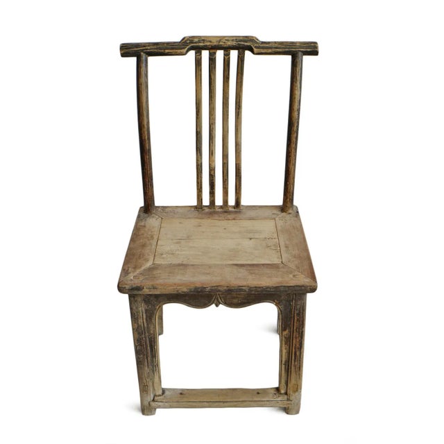 Antique Chinese hand carved wood arm chair with original aged black finish on frame. Seat height is 21".