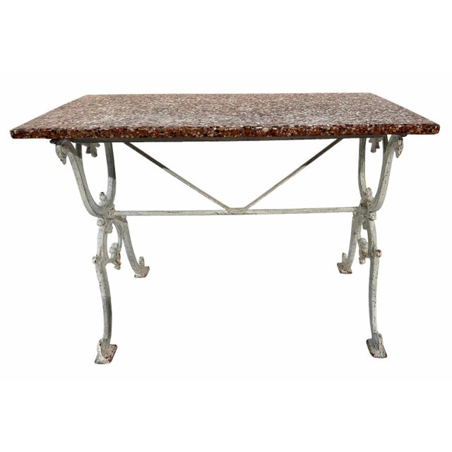 Lovely French cast iron bistro table with a white painted finish and a pink stone composite top. The unique top is old but...