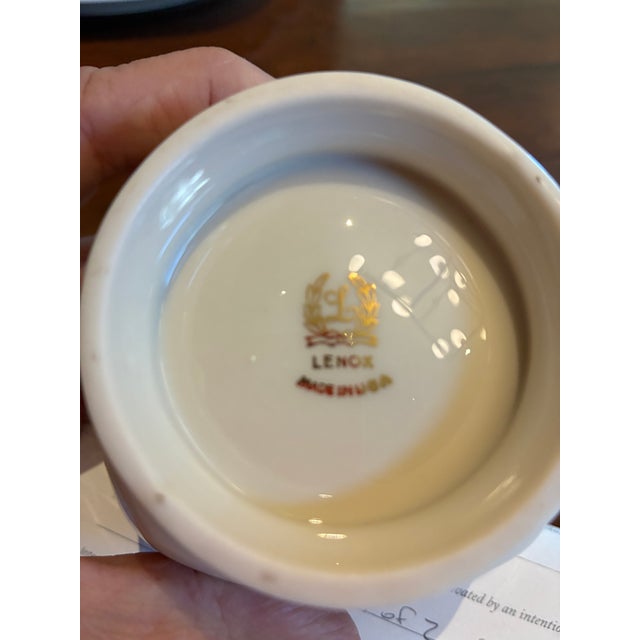 This is a nut or candy dish with matching saucer made by Lenox in their Holiday pattern. Vivid green holly leaves and red...