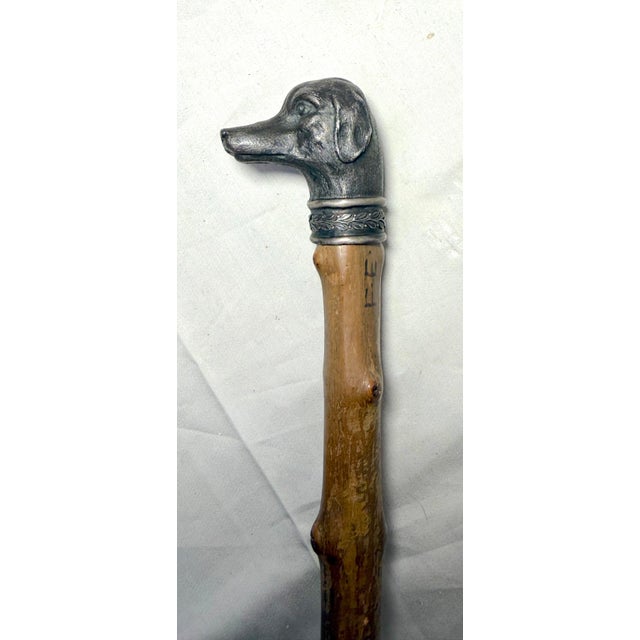 This antique 19th century handmade 800 silver and wooden figural cane is a unique and stylish accessory. The intricate...