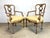 A pair of beautifully distressed French Louis XVI / Directoire style armchairs showing tan and white paint and mahogany...