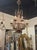 Italian Beaded and Amethyst Chandelier. An Italian beaded and amethyst chandelier sits at the intersection of Venetian...